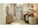 Serene Bedroom featuring a crib, accent chair, dresser, and soft neutral tones at 2940 N 98Th Ln, Phoenix, AZ 85037