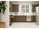 Well-equipped kitchen featuring modern appliances, ample counter space, and stylish cabinetry at 2940 N 98Th Ln, Phoenix, AZ 85037