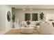 Cozy living room with a comfortable sofa, stylish decor, and plenty of natural light at 2940 N 98Th Ln, Phoenix, AZ 85037