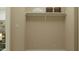 A clean mud room area with a shelf and decorative baskets for stylish storage at 2940 N 98Th Ln, Phoenix, AZ 85037