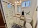 Bright bathroom featuring a walk-in shower, modern vanity, toilet, and neutral tones creates a relaxing space at 305 S Val Vista Dr # 169, Mesa, AZ 85204