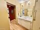 Clean bathroom features vanity, mirror, lighting, and convenient access to other rooms provides functionality at 305 S Val Vista Dr # 169, Mesa, AZ 85204