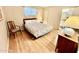 Inviting bedroom with a bed, side tables, dresser, and bright window offering a restful and personal space at 305 S Val Vista Dr # 169, Mesa, AZ 85204