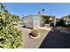 Well-maintained home featuring a low-maintenance landscape, mature trees, and a charming exterior at 305 S Val Vista Dr # 169, Mesa, AZ 85204