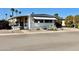 Charming single-story home with covered awning, desert landscaping, and a well-maintained yard at 305 S Val Vista Dr # 169, Mesa, AZ 85204