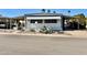 Inviting single-story home with desert landscaping and covered parking, perfect for comfortable living at 305 S Val Vista Dr # 169, Mesa, AZ 85204