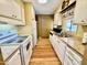 Practical kitchen with white cabinetry, appliances, and durable countertops provides a efficient cooking space at 305 S Val Vista Dr # 169, Mesa, AZ 85204