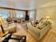 Warm living room with hardwood floors, comfortable seating, and natural light creating an inviting atmosphere at 305 S Val Vista Dr # 169, Mesa, AZ 85204