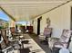 Spacious porch with multiple chairs, offering a comfortable spot for relaxation and outdoor enjoyment at 305 S Val Vista Dr # 169, Mesa, AZ 85204