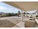 Covered patio seating area overlooking a private backyard with a pool at 3141 E Hillery Dr, Phoenix, AZ 85032