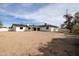 Expansive backyard features a large, grassy area and a white exterior elevation at 3141 E Hillery Dr, Phoenix, AZ 85032