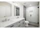 Modern bathroom features double sinks, sleek vanity, and a glass-enclosed walk-in shower at 3141 E Hillery Dr, Phoenix, AZ 85032