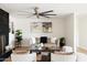 Cozy living room showcasing a modern fireplace, light-colored furniture, and stylish decor at 3141 E Hillery Dr, Phoenix, AZ 85032