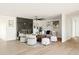 Living room featuring a modern fireplace, neutral furniture, hardwood floors and decor at 3141 E Hillery Dr, Phoenix, AZ 85032