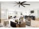 Spacious living space featuring living room, dining area, kitchen and hardwood floors at 3141 E Hillery Dr, Phoenix, AZ 85032