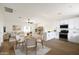 Open living area with modern decor featuring wood floors, eat in kitchen and comfortable seating at 3141 E Hillery Dr, Phoenix, AZ 85032