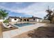 Relaxing outdoor pool with lounge chairs, surrounded by a spacious backyard at 3141 E Hillery Dr, Phoenix, AZ 85032