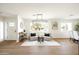 Bright sitting room featuring contemporary furniture, decor and hardwood floors at 3141 E Hillery Dr, Phoenix, AZ 85032