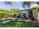 Brick patio with outdoor seating overlooking the landscaped backyard at 3229 E Malapai Dr, Phoenix, AZ 85028