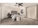 Bedroom with a ceiling fan, decorative shutters, and carpet flooring at 3229 E Malapai Dr, Phoenix, AZ 85028