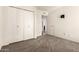 Bright bedroom with carpet, closet, and neutral color palette at 3229 E Malapai Dr, Phoenix, AZ 85028