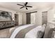 Bedroom showcasing a decorative dresser, closet space, and ensuite bathroom at 3229 E Malapai Dr, Phoenix, AZ 85028