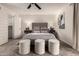 Bedroom with neutral tones, ceiling fan, carpet flooring and modern decor at 3229 E Malapai Dr, Phoenix, AZ 85028