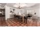 Open-concept dining room featuring terracotta tile, stylish decor, and easy flow to other spaces at 3229 E Malapai Dr, Phoenix, AZ 85028