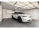 Spacious garage with ample storage and electric vehicle at 3229 E Malapai Dr, Phoenix, AZ 85028