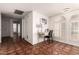 Hallway with decorative tile flooring, office space, and natural light at 3229 E Malapai Dr, Phoenix, AZ 85028