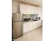 Bright kitchen with stainless steel appliances, subway tile backsplash, and white cabinets at 3229 E Malapai Dr, Phoenix, AZ 85028