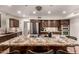 Well-equipped kitchen boasts a granite island, stainless steel appliances, and wood cabinetry at 3229 E Malapai Dr, Phoenix, AZ 85028