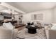 Bright living room featuring stylish furniture, decorative rug, and an open floor plan at 3229 E Malapai Dr, Phoenix, AZ 85028