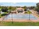 Full basketball court with shade structures and picnic tables showcasing outdoor amenities for residents to enjoy at 36020 W San Ildefanso Ave, Maricopa, AZ 85138