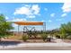 Well-maintained playground with sunshade offering a fun and safe environment for to play at 36020 W San Ildefanso Ave, Maricopa, AZ 85138