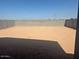 Spacious backyard enclosed by a block wall, ready for landscaping or a pool at 3732 S 87Th Dr, Tolleson, AZ 85353
