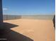 Spacious backyard enclosed by a block wall, ready for landscaping or a pool at 3732 S 87Th Dr, Tolleson, AZ 85353