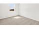 Bedroom featuring a window offering natural light and neutral carpet at 3732 S 87Th Dr, Tolleson, AZ 85353