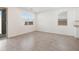 Bright dining area with tile flooring, large windows, and sliding door to the backyard at 3732 S 87Th Dr, Tolleson, AZ 85353