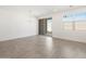 Bright dining area featuring tile floors, sliding glass doors, and modern chandelier at 3732 S 87Th Dr, Tolleson, AZ 85353