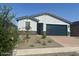 Charming single-story home with a two-car garage and desert landscaping in front at 3732 S 87Th Dr, Tolleson, AZ 85353