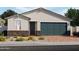 Charming single-story home featuring stone accents, a brick driveway, and a two-car garage at 3732 S 87Th Dr, Tolleson, AZ 85353