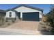 Charming single-story home with a two-car garage and desert landscaping in front at 3732 S 87Th Dr, Tolleson, AZ 85353