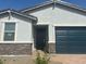 Close up of a charming single-story home with a two-car garage and desert landscaping in front at 3732 S 87Th Dr, Tolleson, AZ 85353