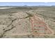 Aerial view of a vast land parcel with outlined property lines, offering potential development opportunities at 385 W Vineyard Rd, Tonopah, AZ 85354