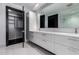 Modern bathroom featuring a dual sink vanity with white countertops and a spacious walk-in closet at 4422 N 75Th St # 6007, Scottsdale, AZ 85251