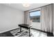 Bright office with a sleek black desk, stylish rug, modern lighting, and neutral colored curtains at 4422 N 75Th St # 6007, Scottsdale, AZ 85251