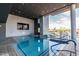 Stunning indoor/outdoor pool with deck lounge area, modern design, and inviting blue waters at 4422 N 75Th St # 6007, Scottsdale, AZ 85251
