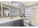 Modern bathroom with a single sink vanity, updated fixtures, and a tub/shower combo at 4514 E Coyote Wash Dr, Cave Creek, AZ 85331