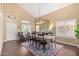 Elegant dining room with high ceilings, a fireplace, and large windows at 4514 E Coyote Wash Dr, Cave Creek, AZ 85331